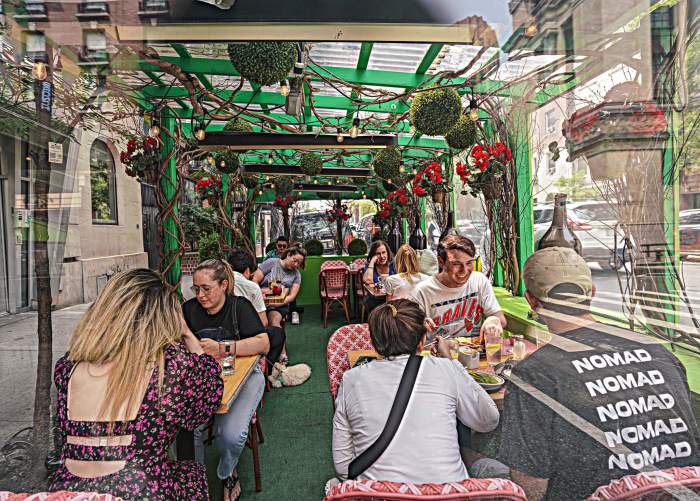 Diners enjoy a meal at Penelope's outdoor shed