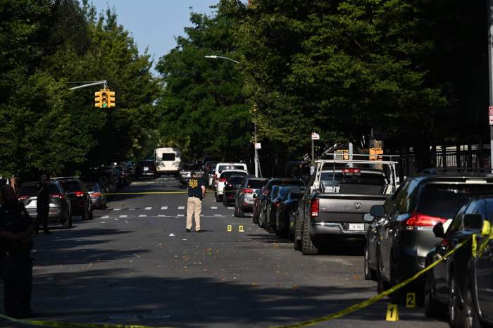 Police at the crime scene where a 25-year-old man was gunned down in Ocean Hill early Tuesday morning