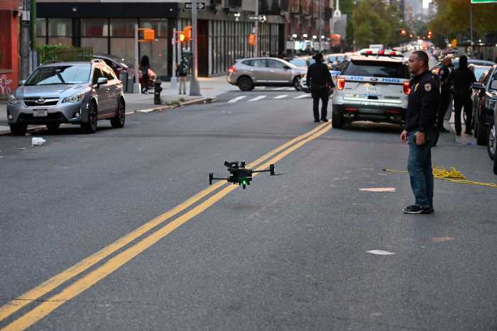 The NYPD’s Technical Assistance Response Unit flies a drone at the scene of a fatal triple shooting in Brooklyn