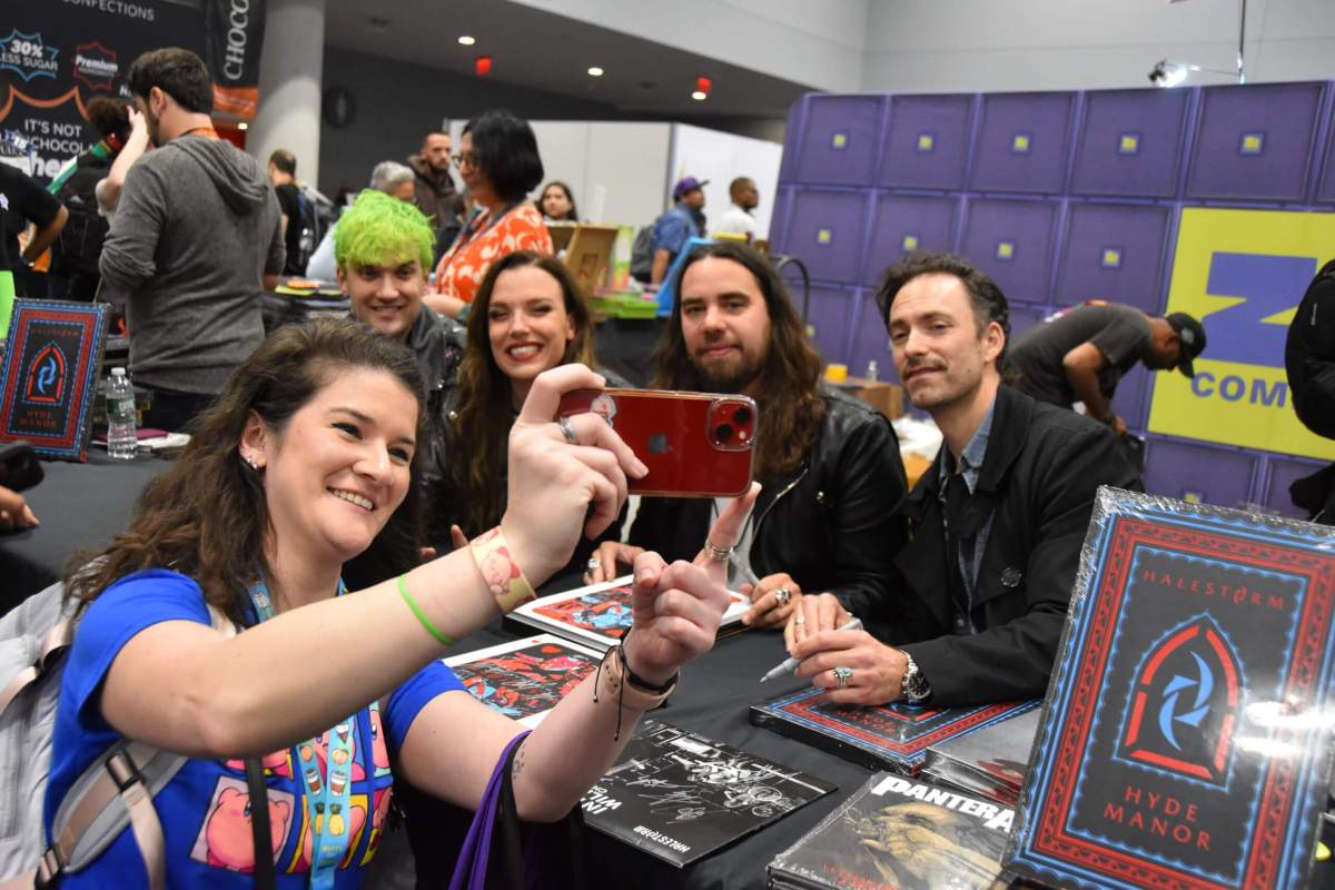 Halestorm takes a selfie with a fan at New York Comic Con.