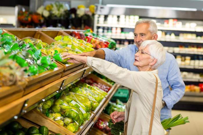 Social Security cost of living adjustment: Seniors at supermarket picking out produce