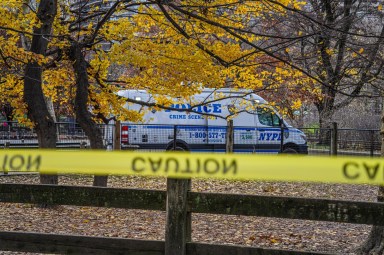 caution tape in front of a police van seen in Central Park