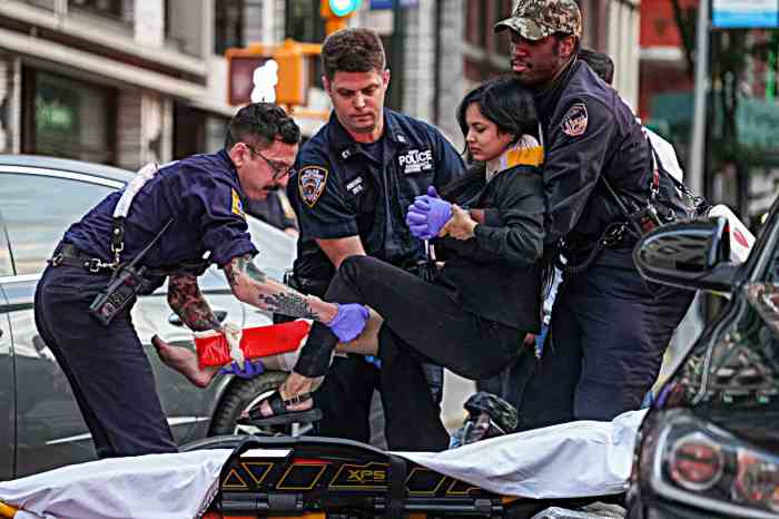 Emergency medical workers at scene with NYPD