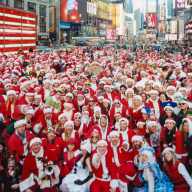 Large group of people in Santa Claus costumes at SantaCon