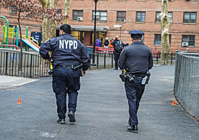Police walk through East Harlem shooting scene