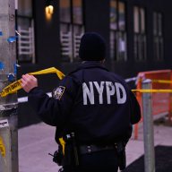 Queens police officer uses crime tape