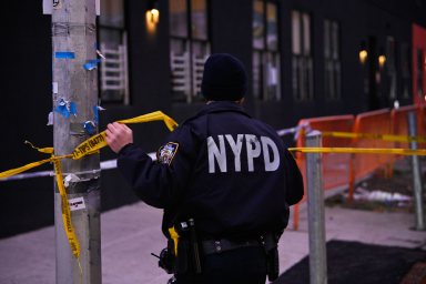 Queens police officer uses crime tape