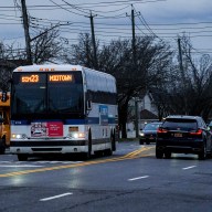 An express bus operating on a rainy street on Staten Island