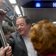 MTA New York City Transit President Richard Davey talking with subway commuters