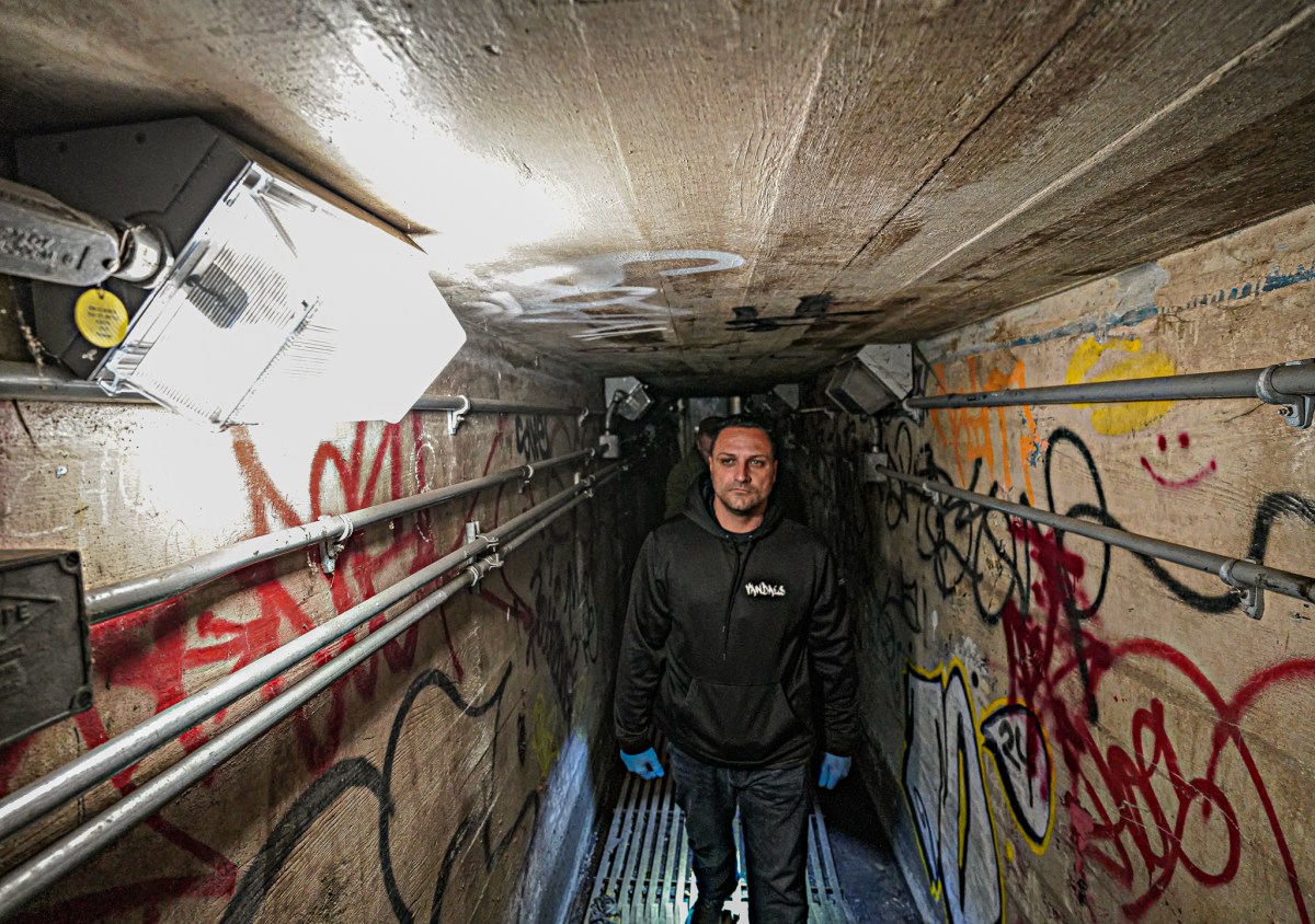 Following along the track in the dim, murky flashlight, the team came upon an array of strewn spray cans, splattered paint, rollers, littering the roadbed