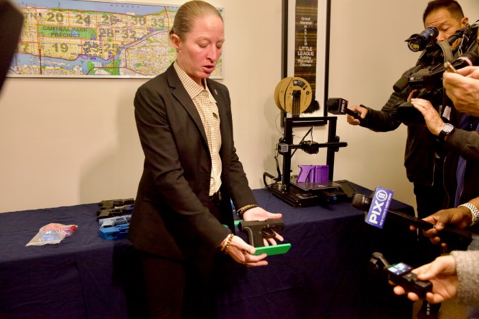 woman showcases a ghost gun