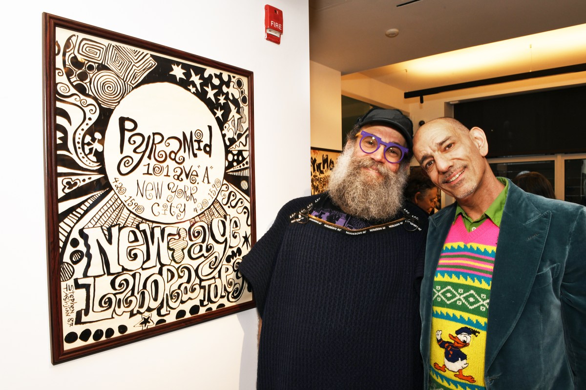 Artist and performer Tabboo! (right) with book copy editor Jorge Clar and one of the many posters that Tabboo ! created for the Pyramid in the 80's