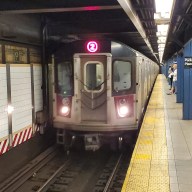 NYC Transit subway train pulls into station