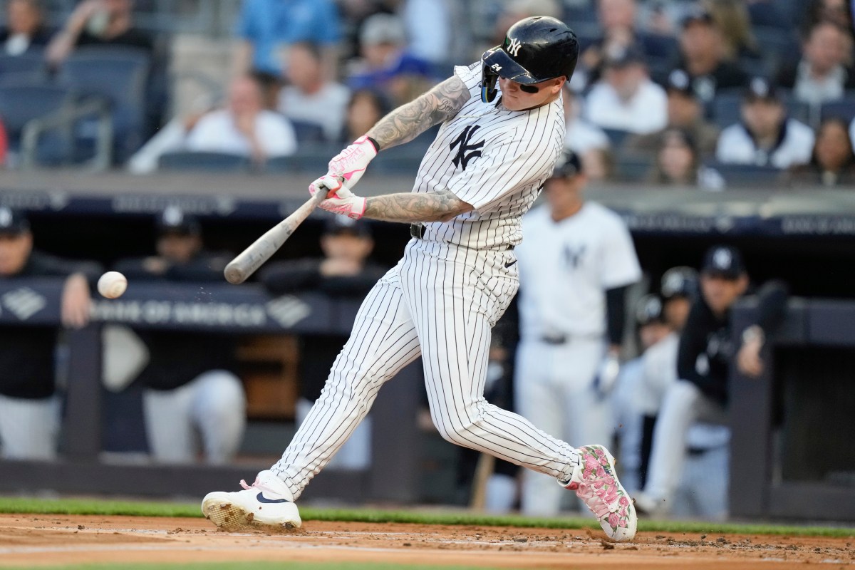 Yankees outfielder Alex Verdugo swinging bat at ball