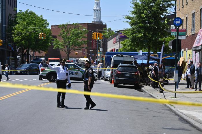 police caution tape across a street in Brooklyn