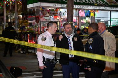 Police say they are searching for a gunman who fired wildly into a Brooklyn Street on Saturday night, hospitalizing a bystander.
