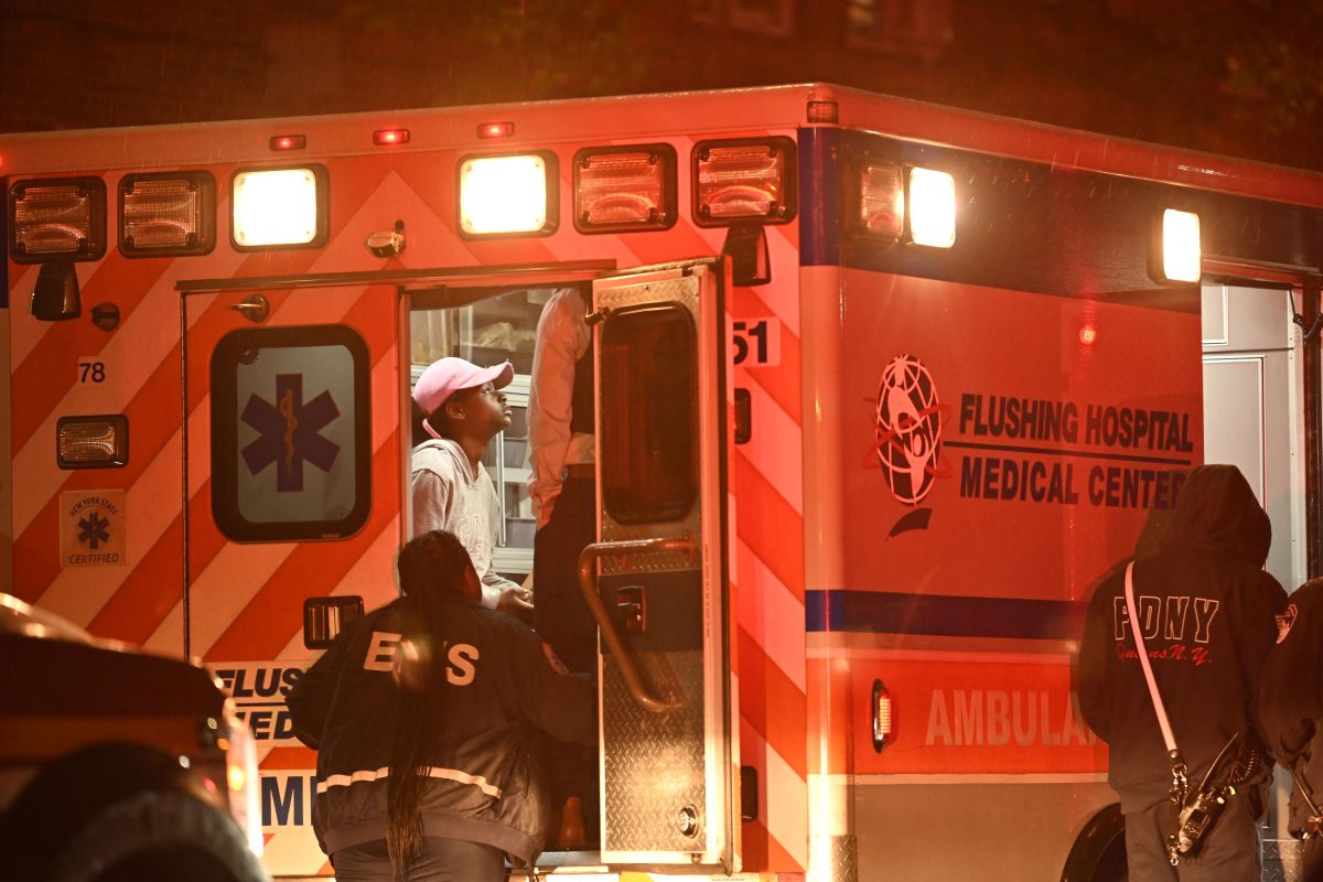 Police from the 103 Precinct could be seen hurriedly rushing around the scene of the shooting while those injured could be seen being treated in an ambulance