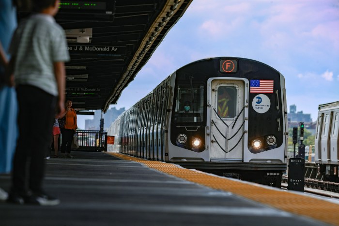 An F train arrives at a Brooklyn station