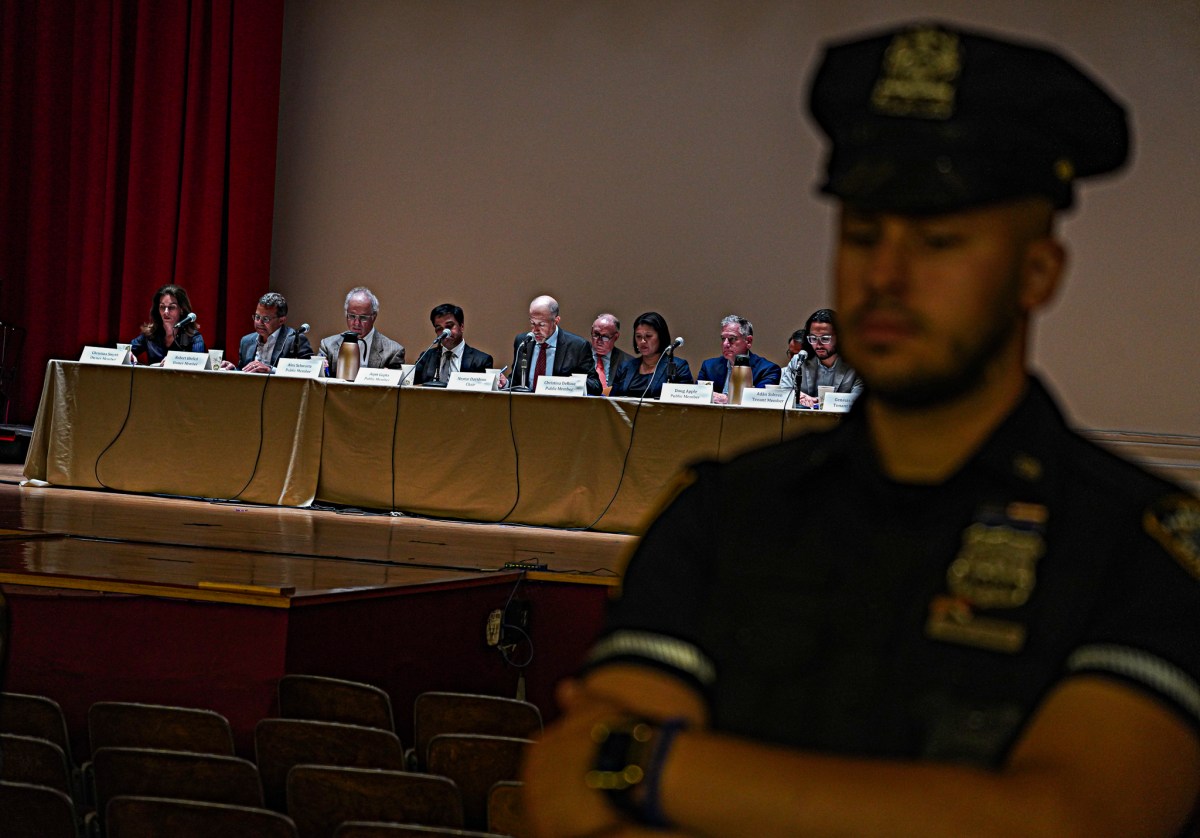 A police officer stands guard as the Rent Guidelines Board meets