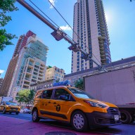 Cars go by congestion pricing gantry in Manhattan