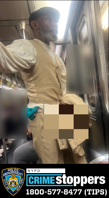 man in beige and white suit on Midtown 