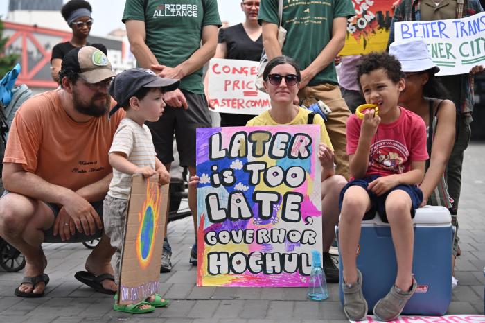 Parents with children at congestion pricing rally in Brooklyn