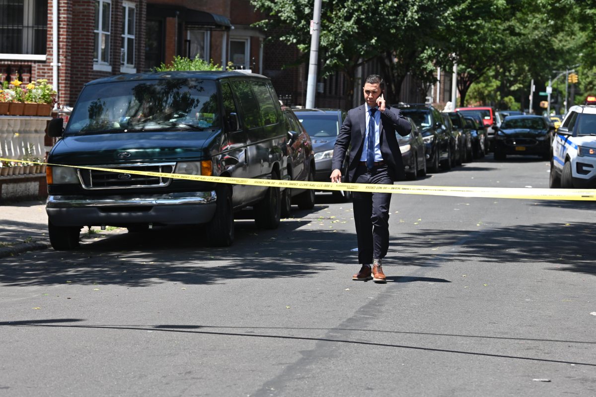 brooklyn police officer guards crime scene after man was shot