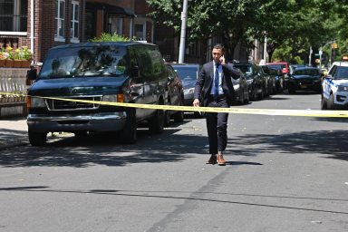brooklyn police officer guards crime scene after man was shot
