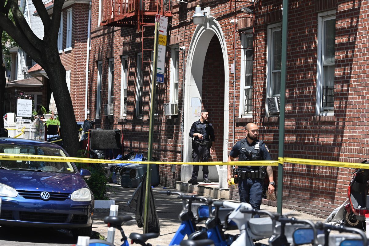 brooklyn police officer guards crime scene after man was shot