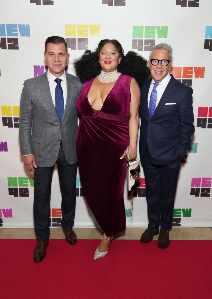Three people at Times Square gala event