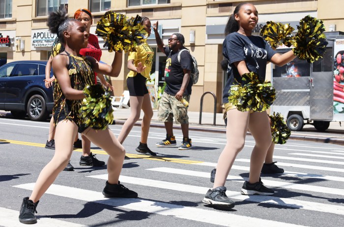 Dancers from the Victory Music and Dance Company in Brooklyn smiled throughout the entire parade route