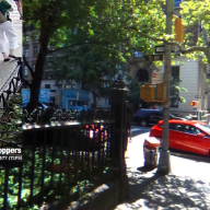 Greenwich Village, Manhattan street in the daytime with a red car