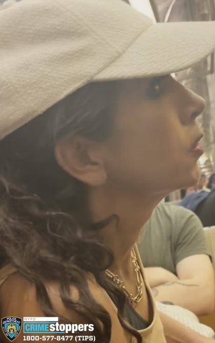 woman wearing a white hat on a Manhattan train