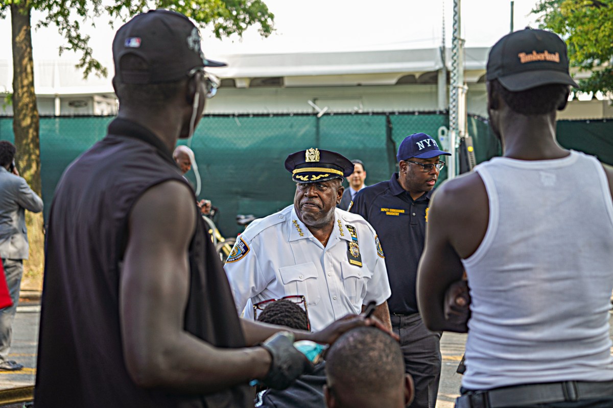 Police brass could be observed overseeing an army of cops wheeling moped after moped out of the tent city.