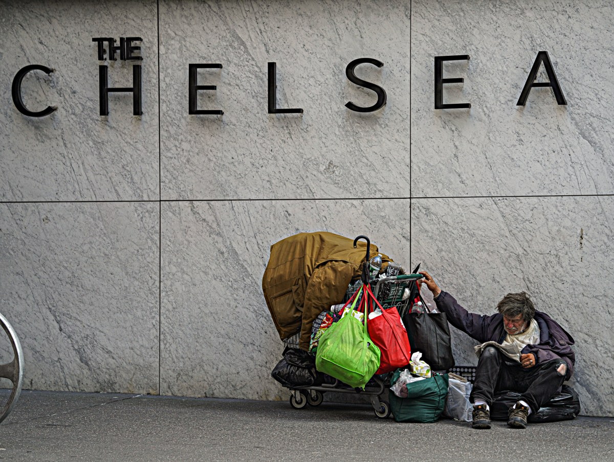 A homeless man sits in Chelsea