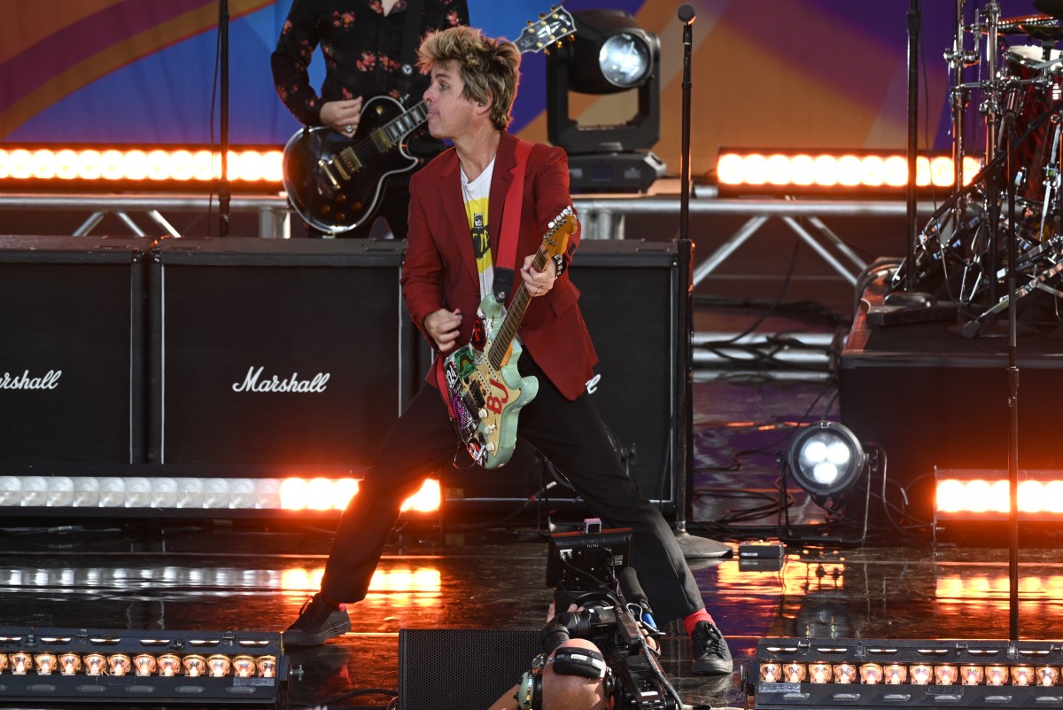 Billie Joe Armstrong performing on stage.