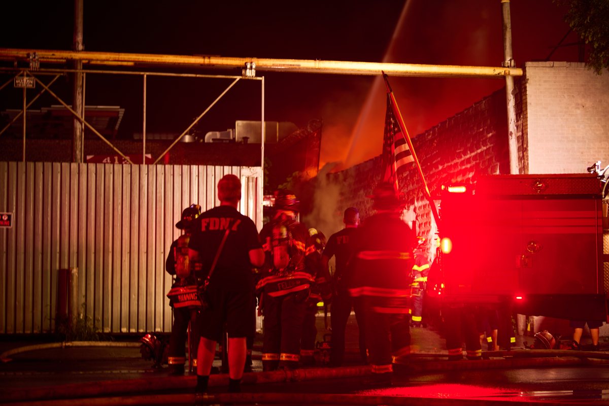 Firefighters battled a four alarm fire that swept through a commercial building at 540 Tiffany Street in Hunts Point on Tuesday morning.