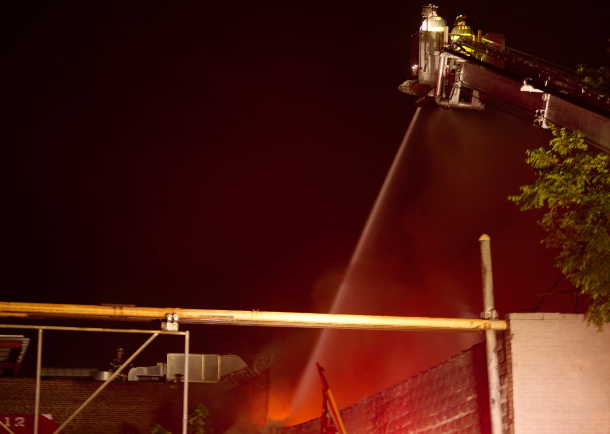 Firefighters used three tower ladders to knock down heavy fire in a one story commercial building at 540 Tiffany Street.