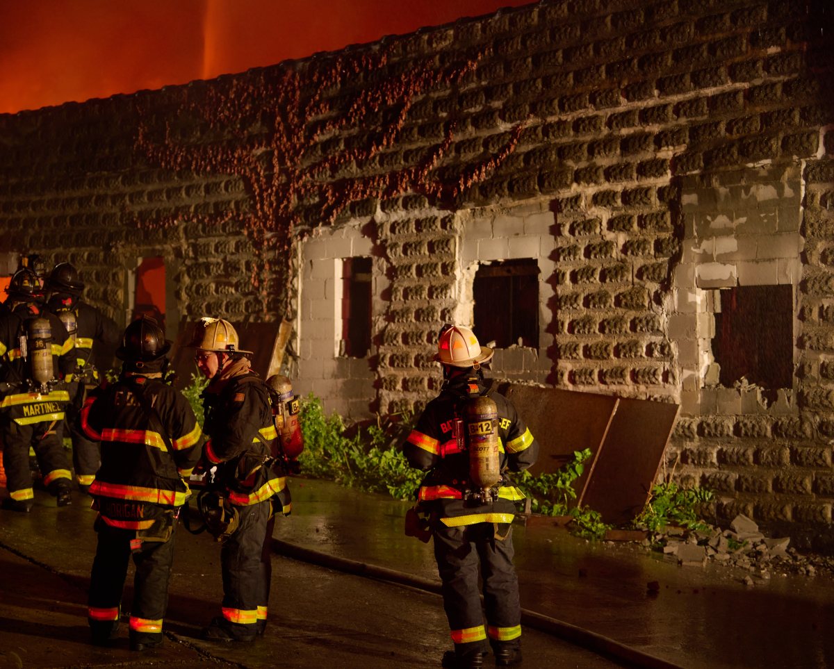 Battalion Chiefs oversee firefighting operations during a four alarm fire on Tiffany Street in the Hunts Point section of the Bronx on Tuesday night.