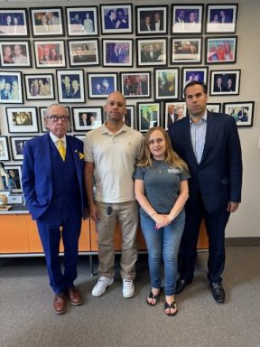 photo of a married couple, with their lawyers, suing the NYC DOE and NYC elementary school