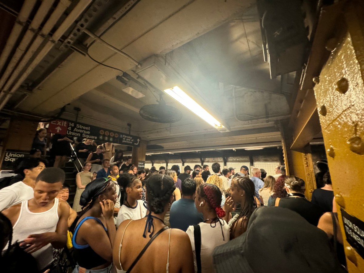 Commuters on crowded L train subway station during subway week of hell