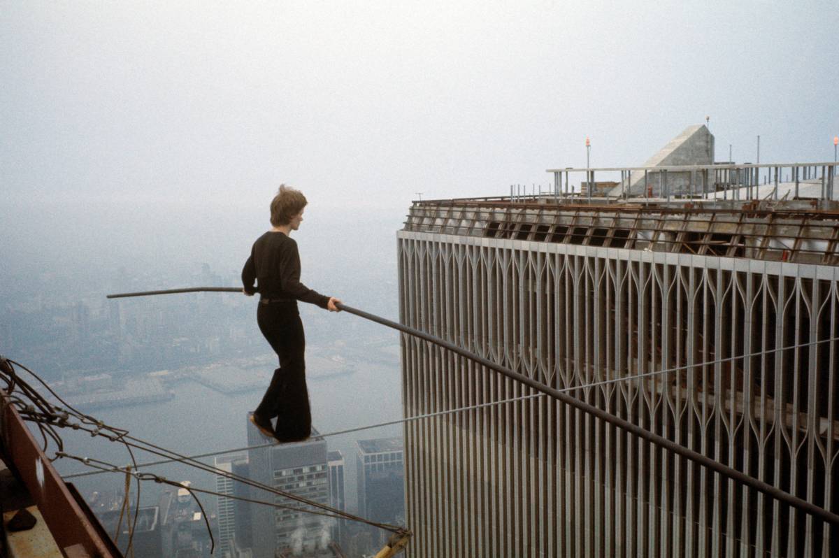 Philippe Petit walks on wire across the twin towers of the WTC