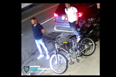 two men standing near bikes in Brooklyn
