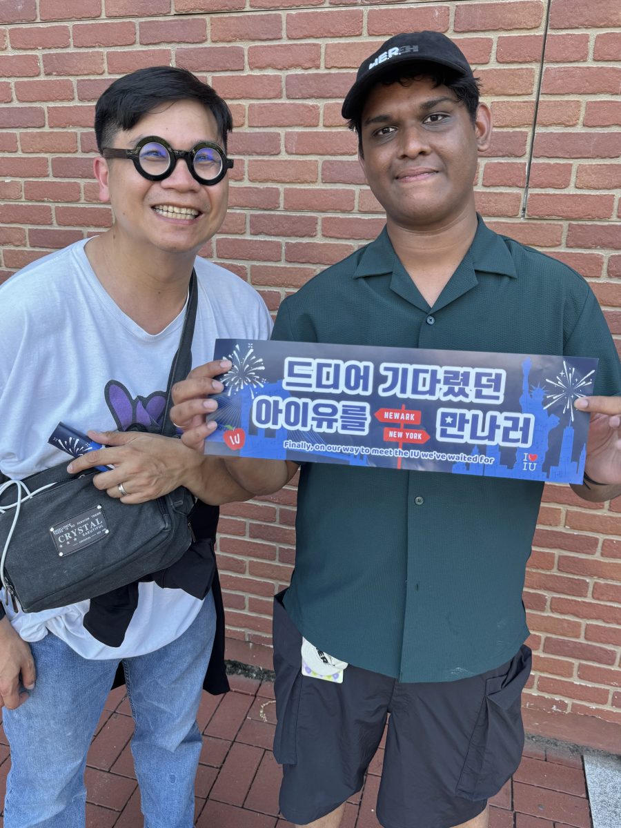 Zunn Islam held up banner he and other fans worked to create for IU's first US performance.