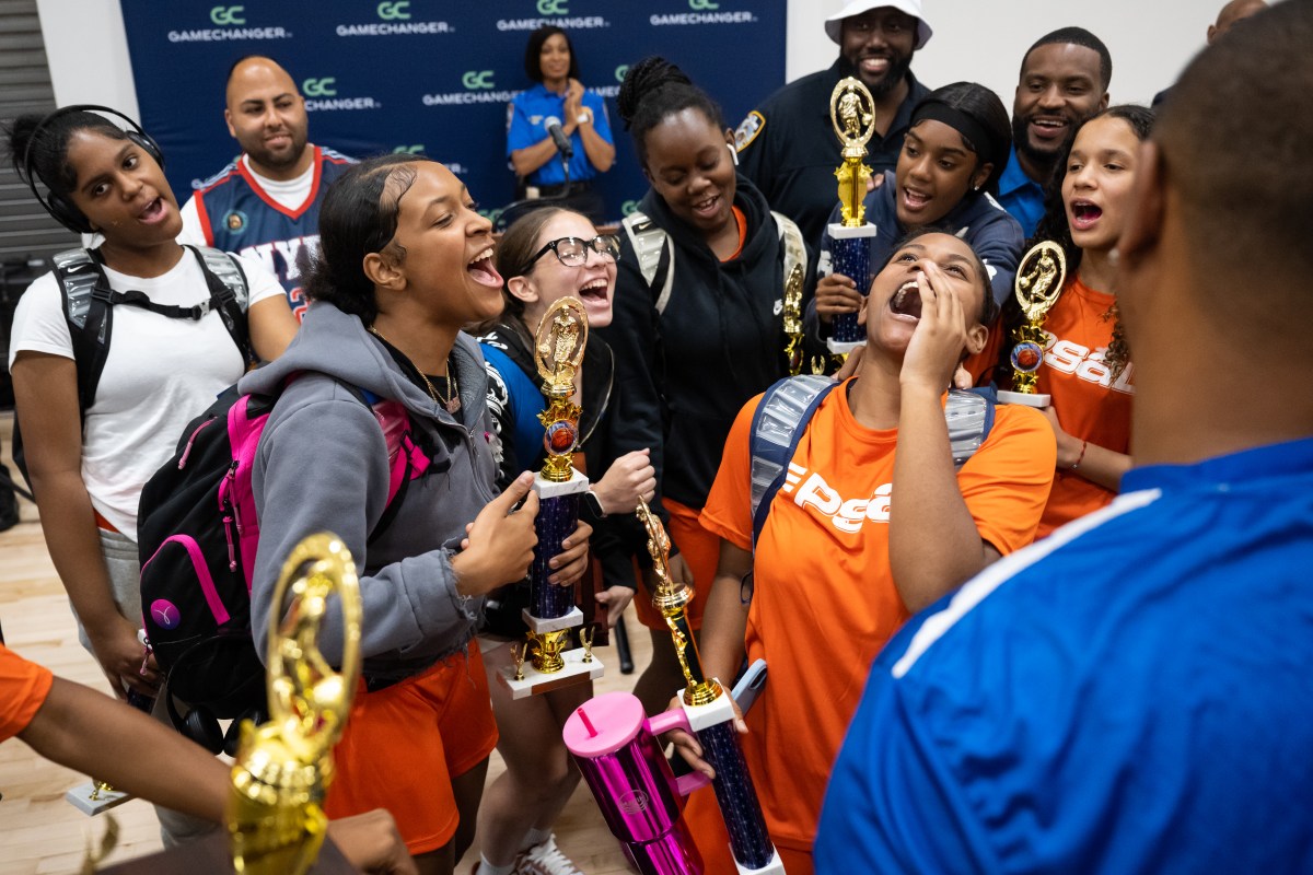 Girls celebrate win in Manhattan youth basketball tournament