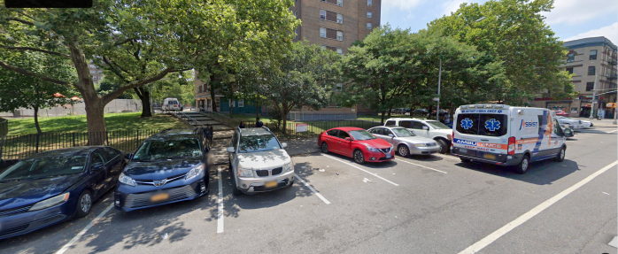 apartment building in Brooklyn with cars parked out front