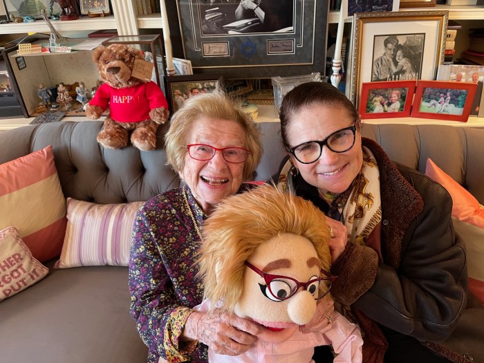 Dr. Ruth Westheimer sitting with a friend in her apartment