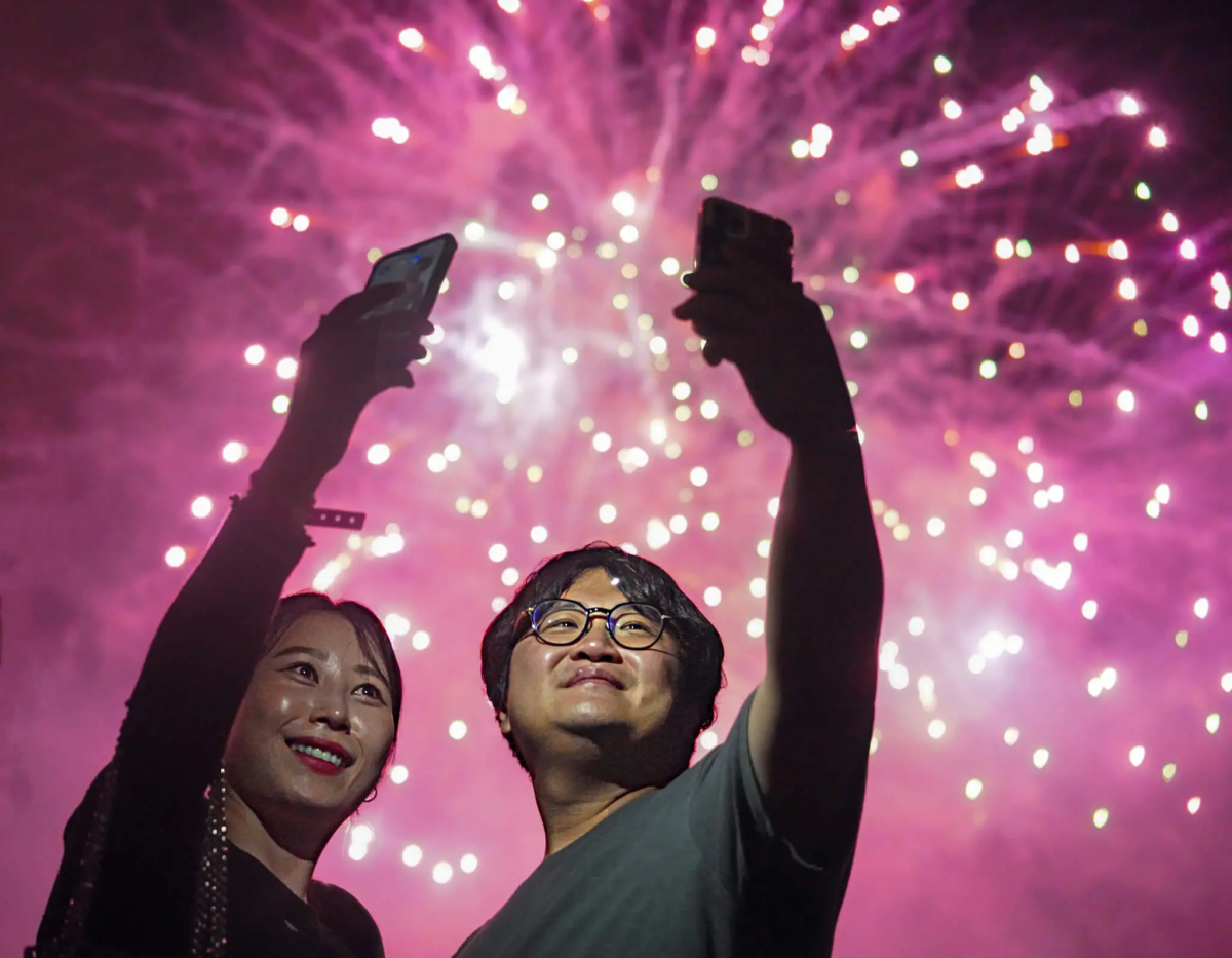 Spectators film themselves at Macy's Fourth of July Fireworks Extravaganza