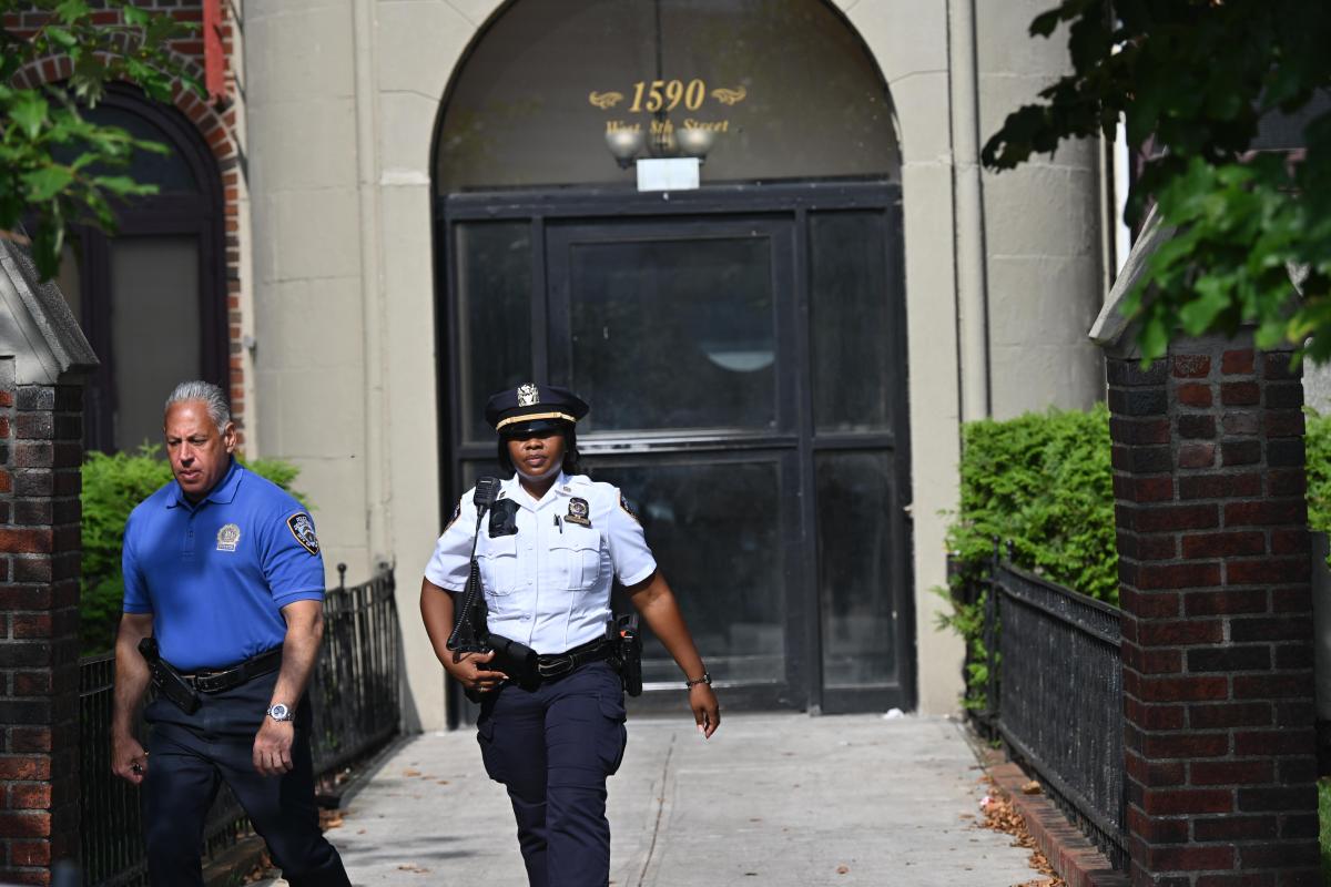 Police leave the scene of the fatal stabbing in Brooklyn