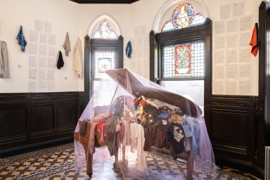 clothing inside a piano at an art exhibit at Green-Wood Cemetery in Brooklyn